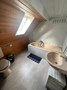 a bathroom with a sink and a bath tub at Gemütliche Wohnung in Pforzheim in Pforzheim