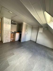 an empty room with a kitchen in a building at Gemütliche Wohnung in Pforzheim in Pforzheim