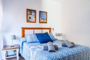 Posteľ alebo postele v izbe v ubytovaní Apartamento IRMASOL