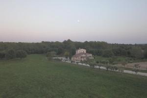 an aerial view of a house in a field at Domaine El Bey - Mas de Provence in Saint-Cannat