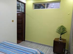 En eller flere senge i et værelse på Mama Africa Killi Villa + 21 billeder