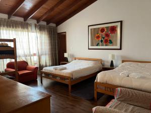 En eller flere senge i et værelse på Hacienda San Pedro Claver Subachoque