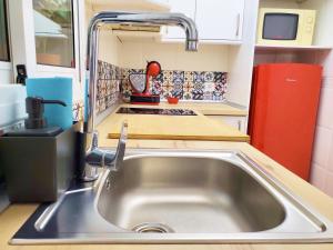 Η κουζίνα ή μικρή κουζίνα στο Apartamento céntrico con patio privado +25 φωτογραφίες