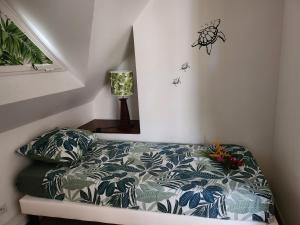 Voodi või voodid majutusasutuse Ti Coco Luce family à Sainte Luce dans village de vacances toas