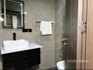 Kopalnica v nastanitvi Grey Residence