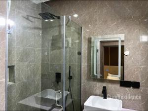 Kopalnica v nastanitvi Grey Residence