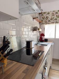 a kitchen with a counter with a coffee maker on it at SAN ISIDRO in Migueláñez