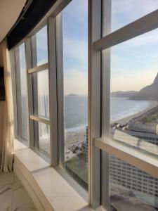 a view of the ocean from a room with windows at Hotel Nacional Rio de Janeiro in Rio de Janeiro