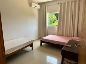 Postel nebo postele na pokoji v ubytování Casa sítio