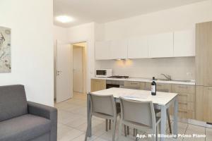 Kuchyňa alebo kuchynka v ubytovaní 3V Apartments Bardolino