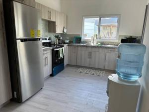 Kuchyň nebo kuchyňský kout v ubytování Villa CAS. nueva en Palma Real