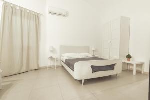 A bed or beds in a room at Zefnea House