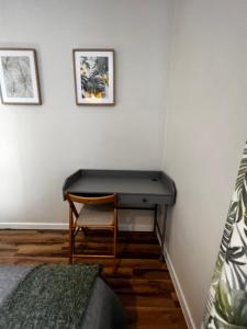 a desk in a room with a chair and a bed at Lodging Młyńska Parking free in Bielsko-Biała