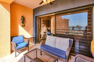 a balcony with a couch and chairs and a glass table at 301 C Princesa de peñasco in Puerto Peñasco