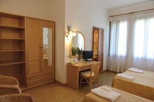 Postel nebo postele na pokoji v ubytování Hotel Villa Orio & Beatrice