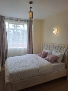 Katil atau katil-katil dalam bilik di Winlee Suites