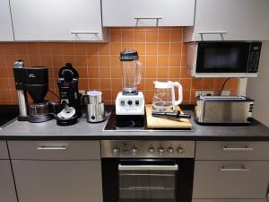 a kitchen with a counter with a blender on it at Grüne Oase Nr.2, nahe Uni und Technologie Quartier in Bochum