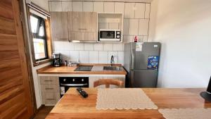 Kuchyň nebo kuchyňský kout v ubytování Origenes Apartments + 13 fotografií