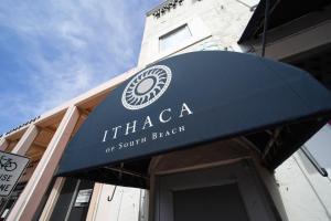 a blue awning over the door of a restaurant at Ithaca in Miami Beach +19 photos