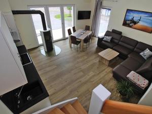 a living room with a couch and a table at Appartement Hafenflair am Plauer See in Plau am See