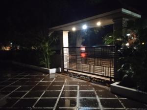 a house with a gate at night at Casa Coutinho in Porvorim
