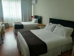 Postel nebo postele na pokoji v ubytování Hotel Del Rio