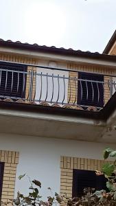 a balcony on a building with a metal railing at B&B "LE LUCI" CAMERA IN ATTICO GRAN VISTA interno 4 in Vasto