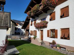 a building with flower boxes on the side of it at Beilelers Hof in Arzl im Pitztal