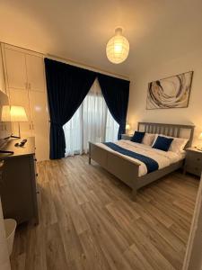 Postel nebo postele na pokoji v ubytování SG Homes