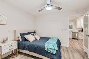 a bedroom with a bed and a ceiling fan at 2-1 San Diego Getaway Home Near Major Attractions in San Diego