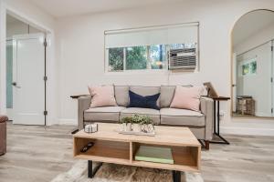 a living room with a couch and a coffee table at 2-1 San Diego Getaway Home Near Major Attractions in San Diego