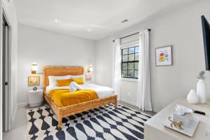 a bedroom with a bed and a window at Hot Tub + Fire Pit + Pool + Game Room ~ Guesthouse in Manor +45 photos