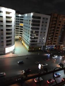 a view of a city street at night with buildings at شقة مفروشة مدينة نصر in Cairo