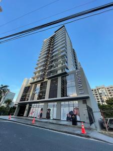 a tall building with orange cones in front of it at Altazona - Living 73 in Panama City