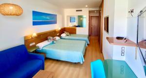 Postel nebo postele na pokoji v ubytování Hotel Blaucel