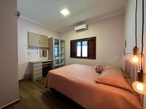 מיטה או מיטות בחדר ב-Casa com Area Gourmet e Banheira