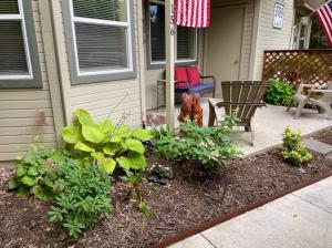 a porch of a house with a bench and plants at Hidden Gem in SE Boise with hot tub and wood burning fireplace in Boise