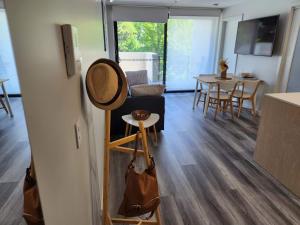 a kitchen and living room with a table and chairs at Home@Braddon in Canberra