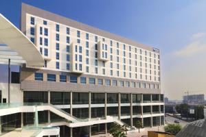 a large white building with a lot of windows at City Express by Marriott Monterrey Universidad in Monterrey