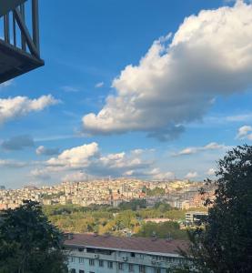 a view of a city with buildings on a hill at Mika Homes in Istanbul