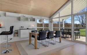a kitchen and dining room with a table and chairs at Stunning Home In Esbjerg V With Kitchen in Esbjerg