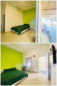 a bedroom with green walls and a bed and a balcony at Homestay BONO Mũi Né in Phan Thiet