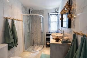 a bathroom with a shower and a sink at Manao Seaview Pool Villa 25 - 5 Mins Walk To The Beach in Ko Lanta +32 photos