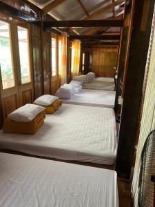 a row of bunk beds in a room at Homestay Hoa Thao in Mù Cang Chải