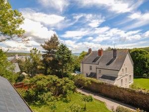 an aerial view of a house with a yard at Charnwood Cottage in Dale