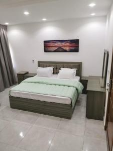 a bedroom with a large bed with at GRAND VILLA DAKAR in Dakar
