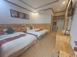 Postel nebo postele na pokoji v ubytování Dang Khoa Garden Inn Homestay