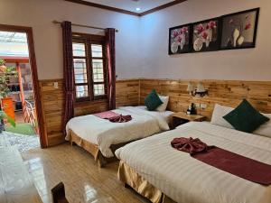 Postel nebo postele na pokoji v ubytování Dang Khoa Garden Inn Homestay