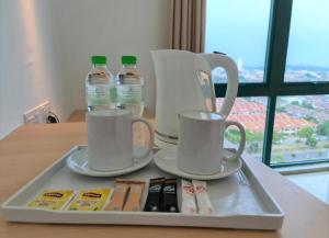 Příslušenství pro přípravu čaje a kávy v ubytování Swan Garden Resort Hotel