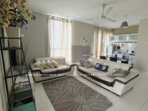 a living room with two couches and a kitchen at Tamarind Suites or D'Pulze Residence or Domain NeoCyber, click Room selection for location and pics in Cyberjaya